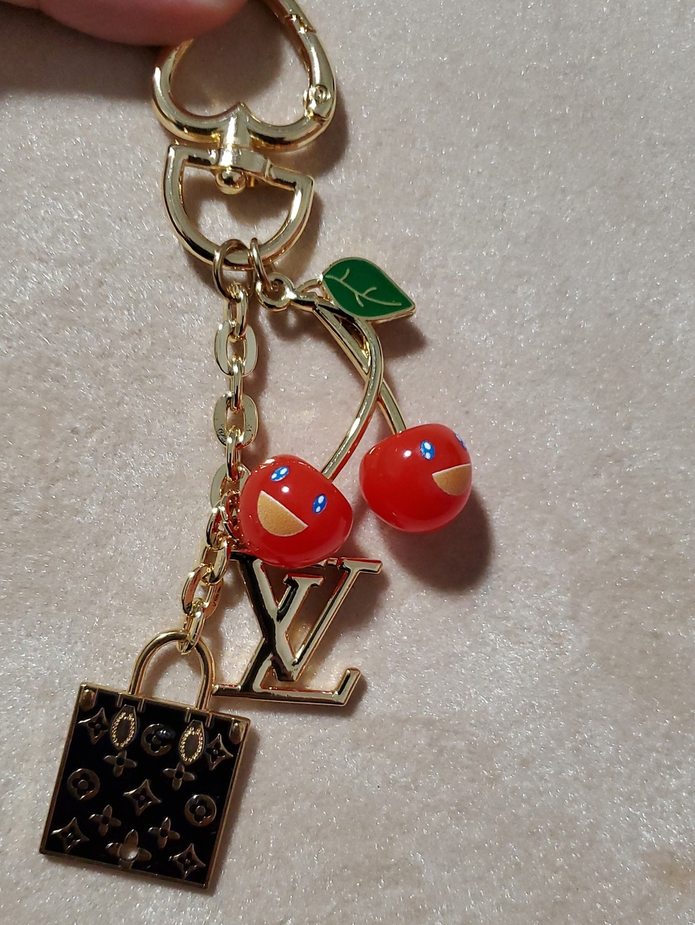 Gold-Tone Keychain with Red Enamel Cherries and Black Charm